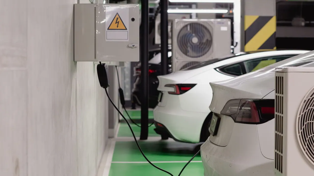 Electric vehicles charging in a modern underground parking garage
